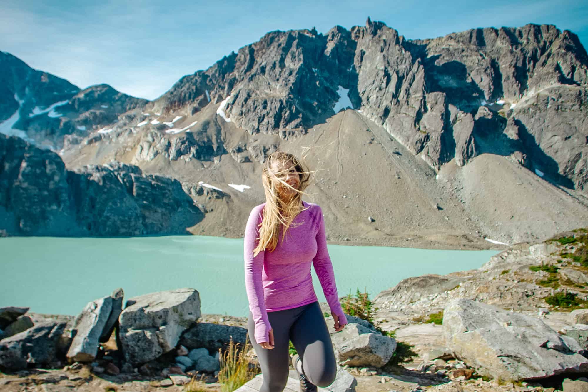 Wedgemount Lake Hike.

Photo of a woman walking towards the camera laughing and wind in her hair. In the background is a mountain peak with a turuoise lake at the bottom.