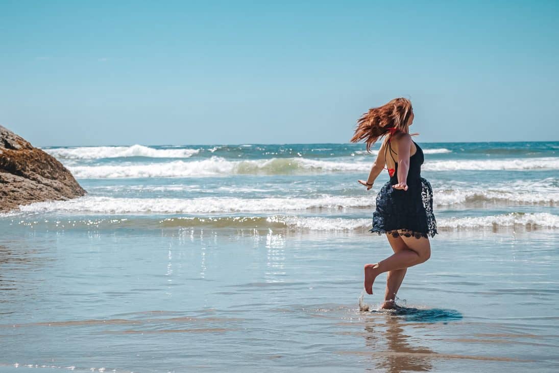 Twirling around in the shallow ocean at Chesterman Beach - one of the top things to do in Tofino