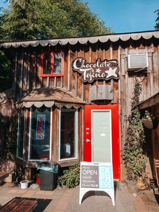 Chocolate Tofino - outside interior of chocolate and gelato shop with red door and logo