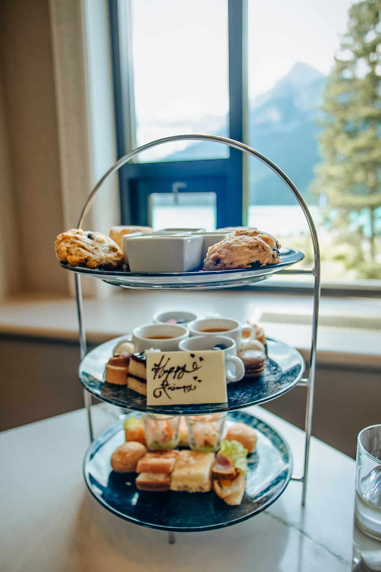 Tray of sandwiches and cakes at the Fairmont Chateau Lake Louise. 