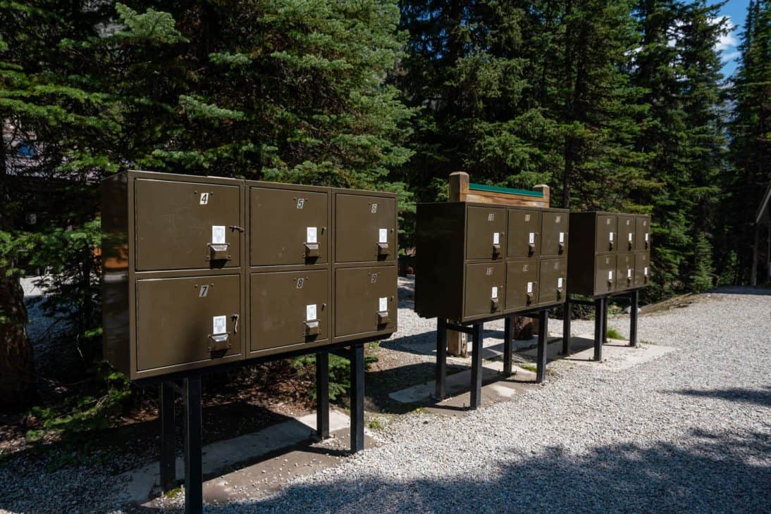 Photo of brown coloured food storage lockers in rows of 6 at Lake O'Hara campground.