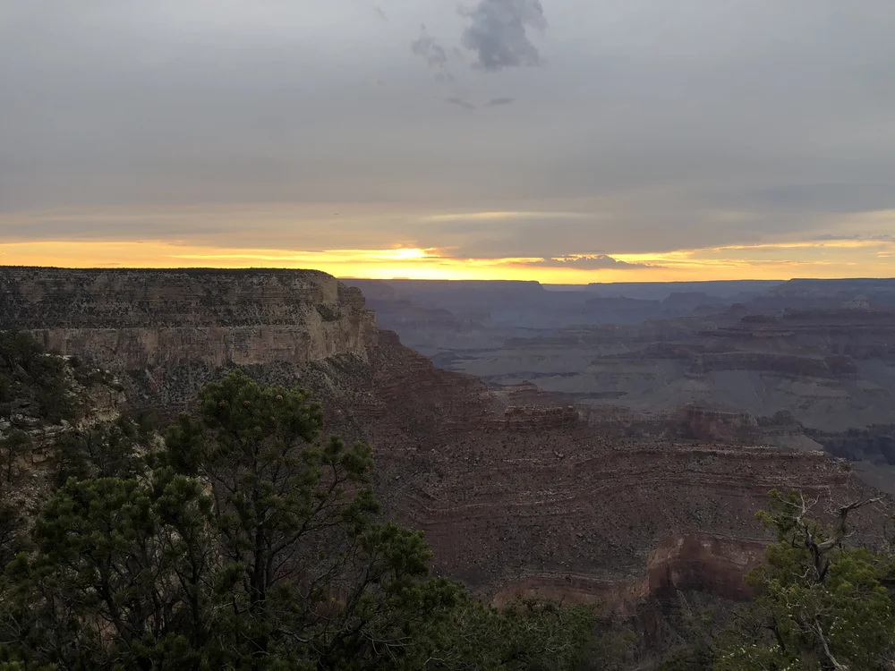 Photo of the sun setting over the Grand Canyon. 