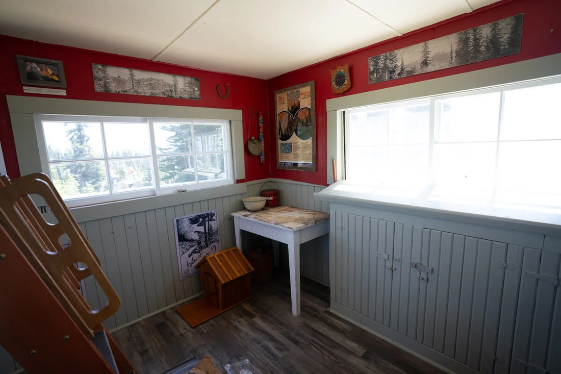 The inside of the Fire Lookout at Mount Revelstoke is filled with interpretive signs documenting its history.