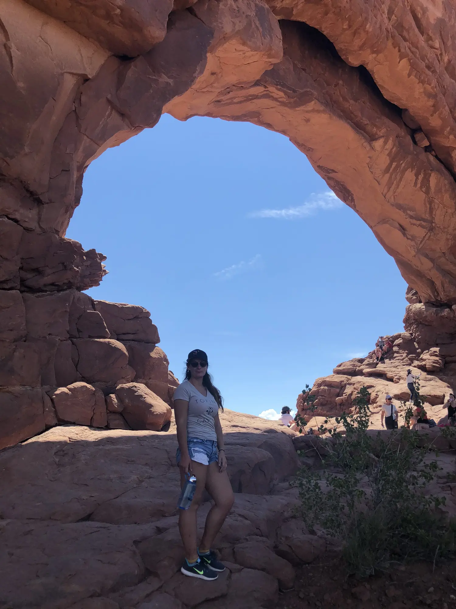 Rachael standing at the base of the North Window arch in Arches National Park, Utah. 
