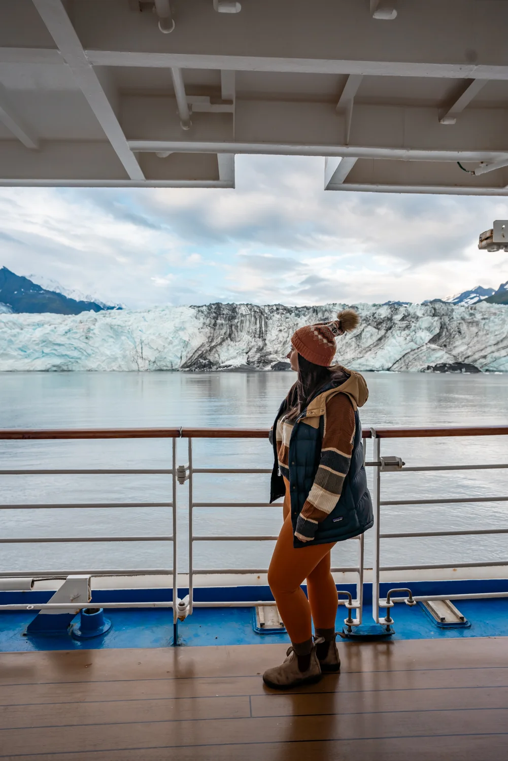 Rachael on the Sapphire Princess ship with Harvard Glacier in the background.